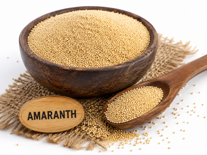 Amaranth millet seeds in wooden bowl with amaranth seeds in spoon, displayed on natural jute mat.