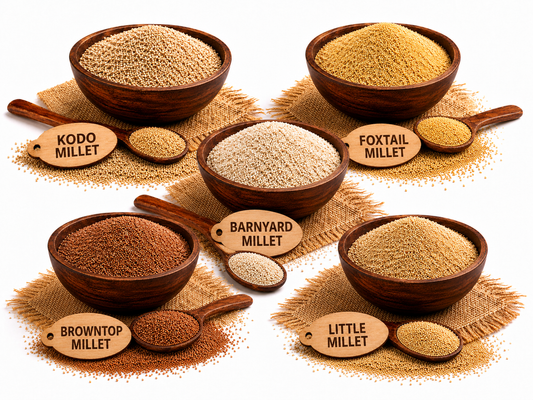 Shridhanya millet combo featuring foxtail, little, barnyard, browntop and kodo millets in wooden bowls with wooden spoons.